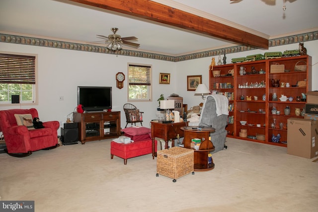 living room with carpet flooring, a wealth of natural light, and beamed ceiling