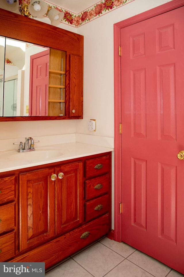 bathroom featuring tile patterned flooring and vanity