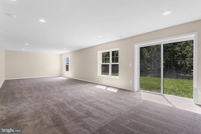 unfurnished living room featuring carpet