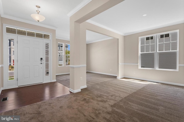 foyer featuring crown molding and dark wood-type flooring