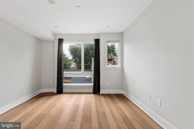 spare room with light hardwood / wood-style floors