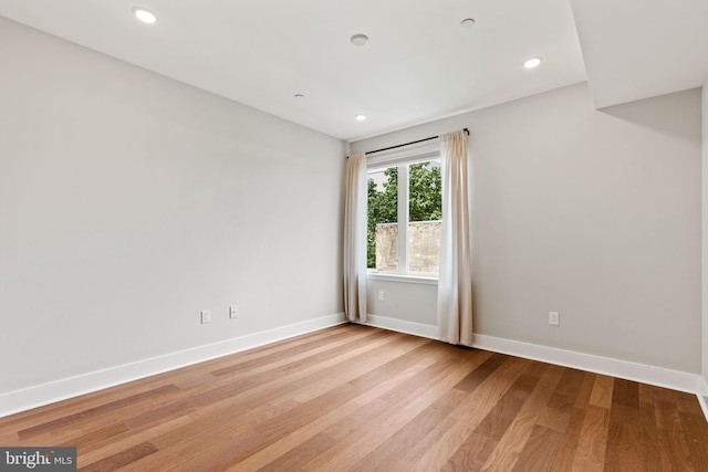 unfurnished room featuring light wood-type flooring