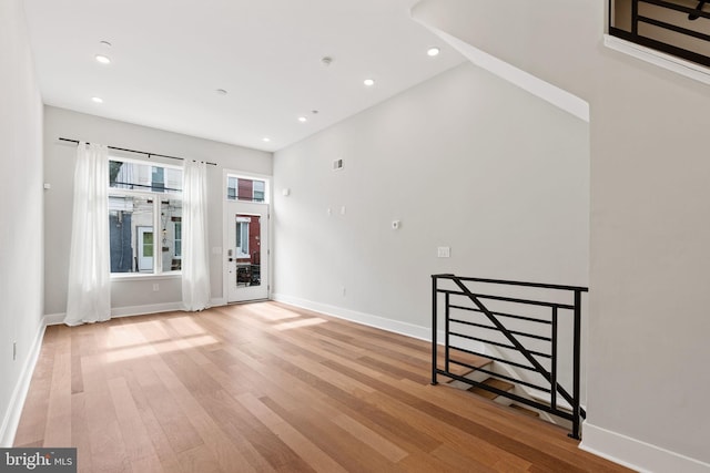 empty room with light hardwood / wood-style floors