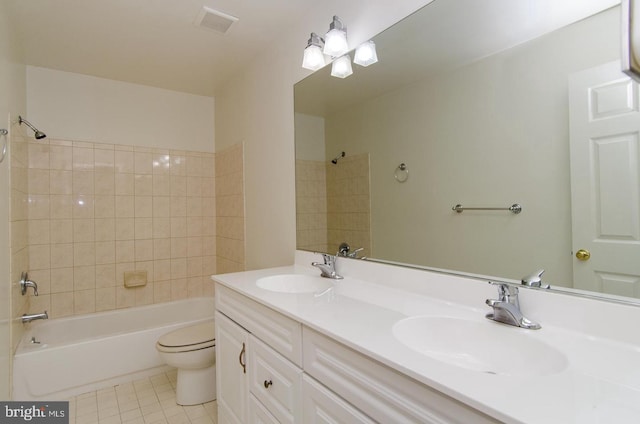 full bathroom with tile patterned flooring, vanity, bathtub / shower combination, and toilet