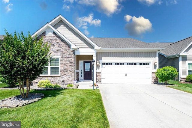 craftsman-style home featuring a front yard and a garage