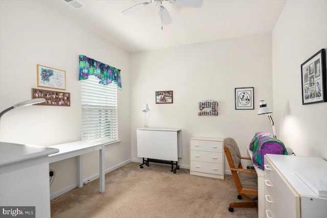 carpeted home office with ceiling fan