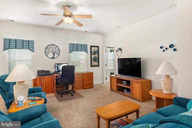 office featuring light carpet, plenty of natural light, and ceiling fan