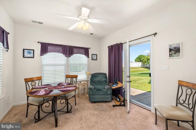 living area featuring ceiling fan and light carpet