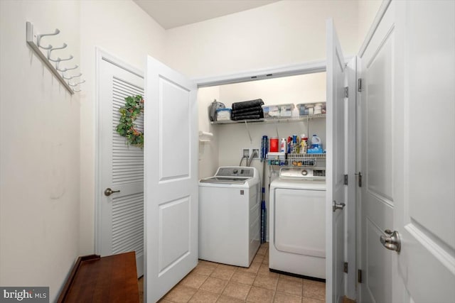 washroom with independent washer and dryer