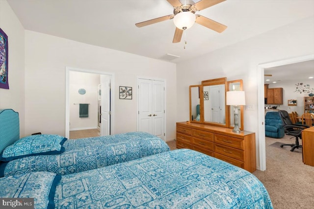 carpeted bedroom featuring ensuite bathroom and ceiling fan