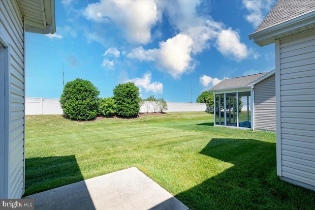 view of yard with a patio and a sunroom