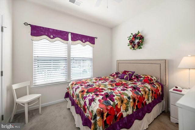 bedroom with light colored carpet and ceiling fan