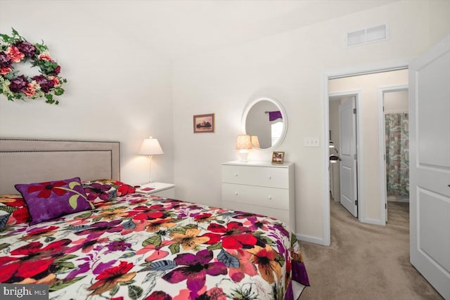 bedroom with light colored carpet