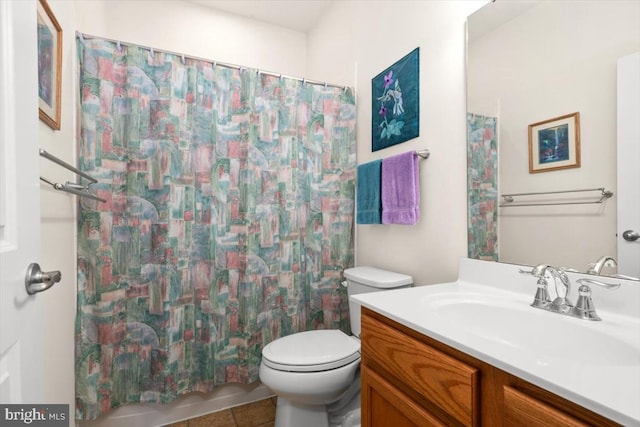 bathroom with tile patterned flooring, vanity, toilet, and a shower with shower curtain