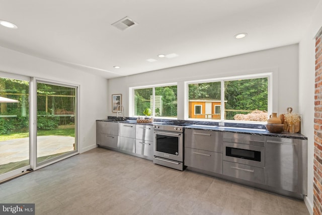 kitchen with recessed lighting, visible vents, gray cabinetry, appliances with stainless steel finishes, and modern cabinets