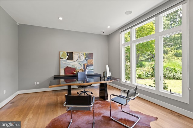 home office featuring light wood-type flooring, visible vents, baseboards, and recessed lighting