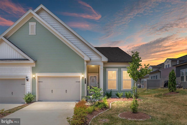 view of front of house with a lawn and a garage