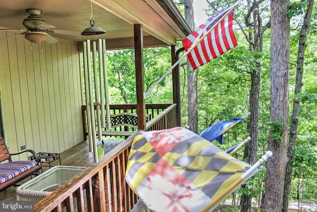 wooden terrace featuring ceiling fan