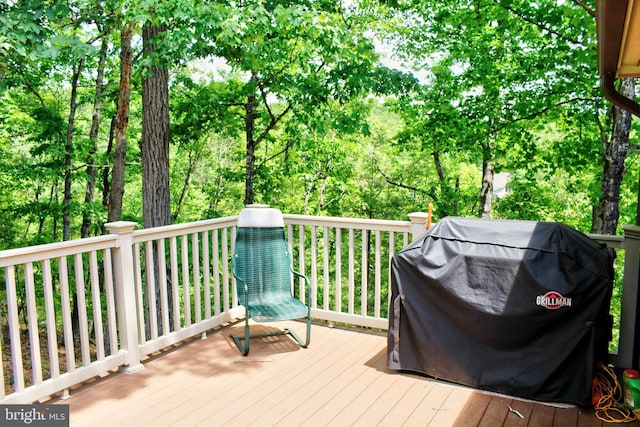 wooden terrace featuring grilling area