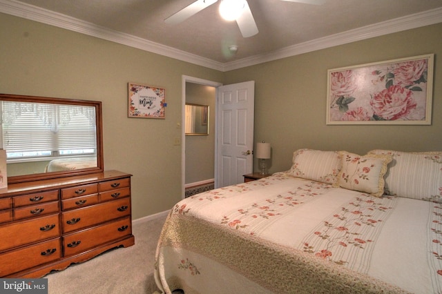 bedroom with ceiling fan, ornamental molding, and light carpet