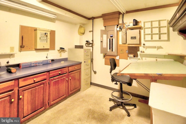 kitchen with light carpet, electric panel, and crown molding