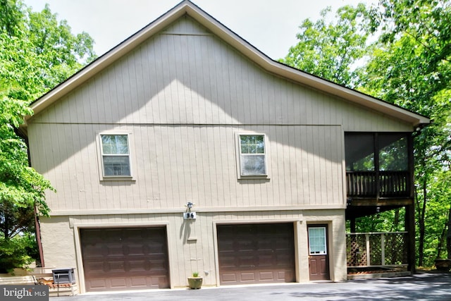 view of property exterior featuring a garage