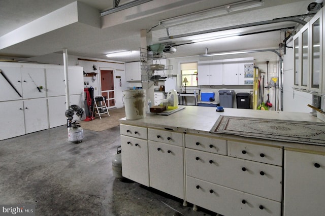 kitchen featuring white cabinetry