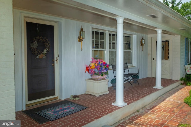 doorway to property with a porch