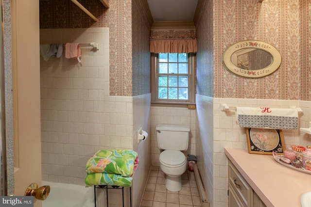 bathroom with tile walls, tile patterned flooring, vanity, toilet, and crown molding