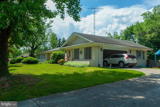 ranch-style home with a garage and a front lawn