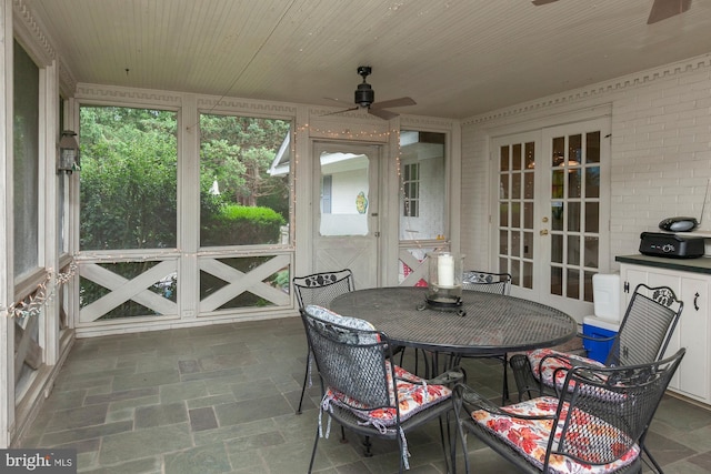 sunroom / solarium with wood ceiling, french doors, and ceiling fan