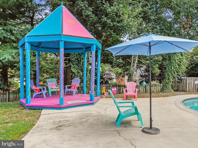 view of play area with a gazebo and a patio