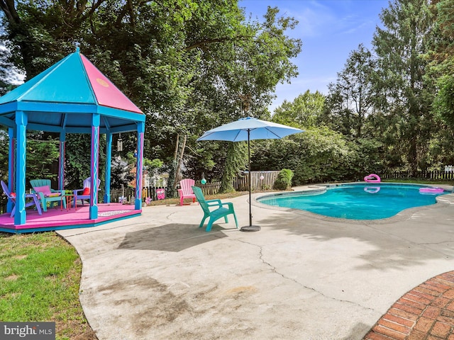 view of pool featuring a gazebo and a patio area