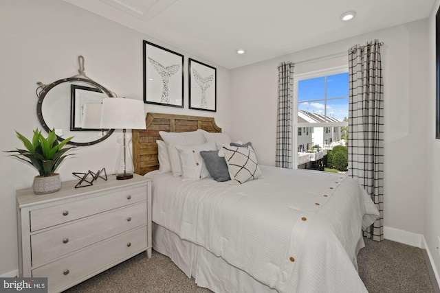 carpeted bedroom featuring recessed lighting and baseboards