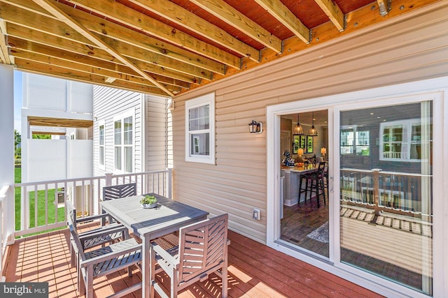 wooden deck with outdoor dining space