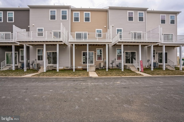 back of house featuring entry steps and central air condition unit