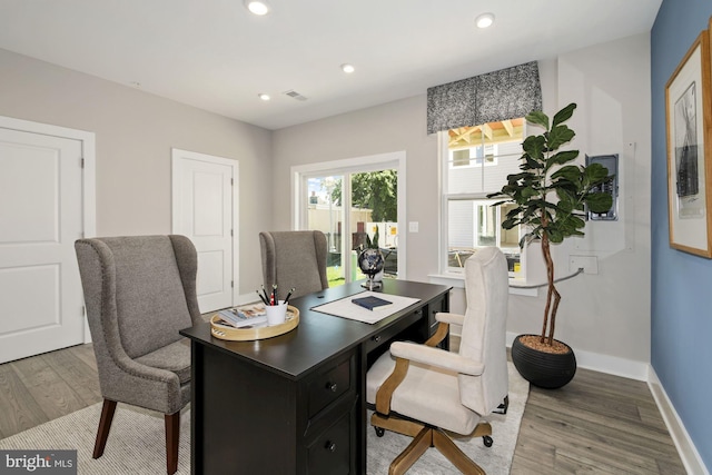 office with recessed lighting, wood finished floors, visible vents, and baseboards