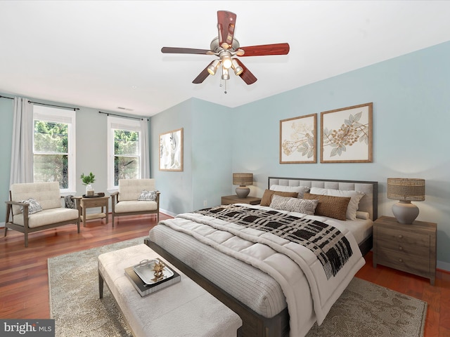 bedroom featuring ceiling fan and dark hardwood / wood-style floors