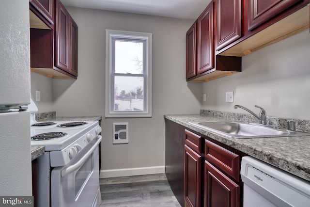 kitchen featuring dark hardwood / wood-style floors, white appliances, and sink