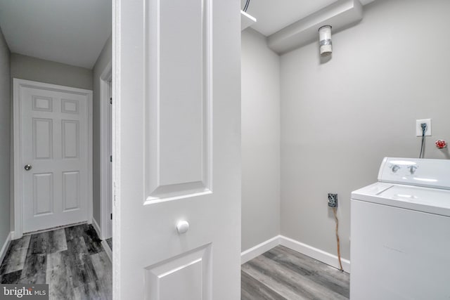 laundry area with dark hardwood / wood-style flooring and washer / clothes dryer