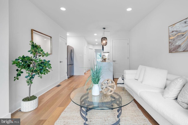 living room with light hardwood / wood-style floors