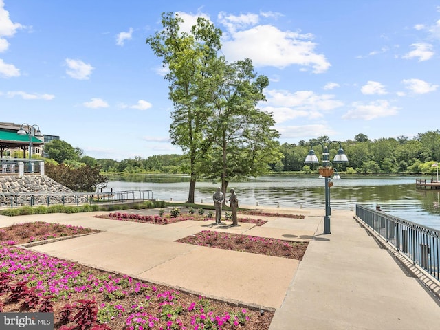 surrounding community with a water view