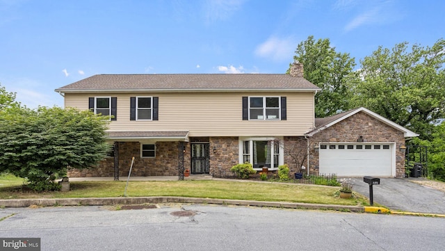 view of front facade with a front lawn and a garage