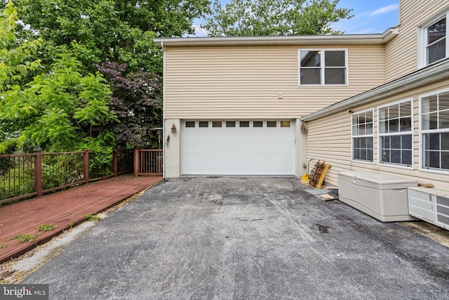 garage with aphalt driveway