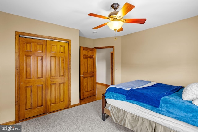 unfurnished bedroom with a closet, light wood-type flooring, and ceiling fan