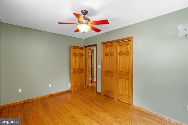 bedroom with ceiling fan and light hardwood / wood-style flooring