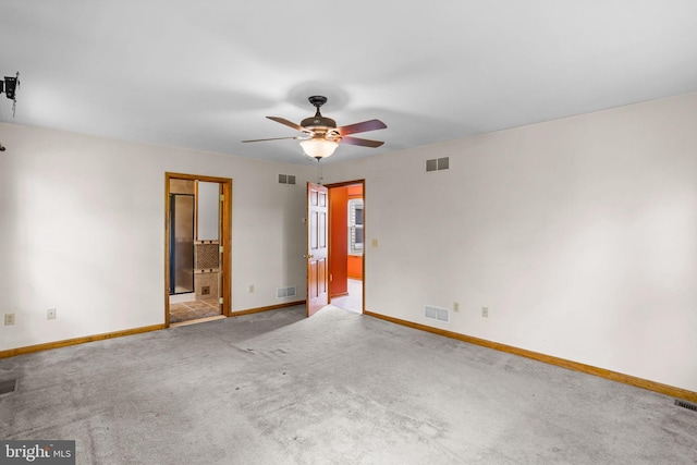 bathroom featuring vanity, tile patterned flooring, toilet, and walk in shower