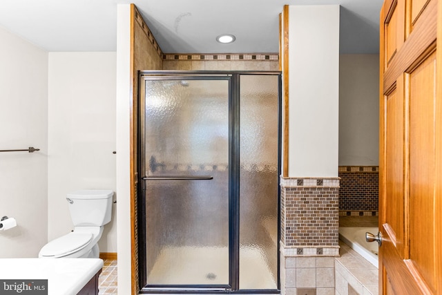 bathroom featuring vanity, toilet, and plenty of natural light