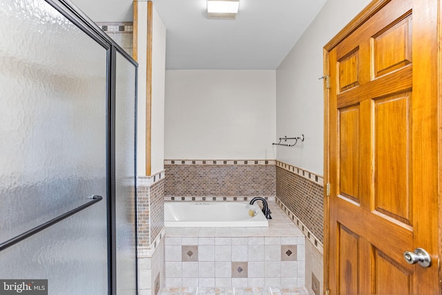 bathroom with tiled tub