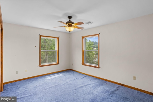 unfurnished bedroom with light colored carpet, a closet, and ceiling fan